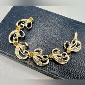 Vintage gold tone link bracelet with topaz rhinestones